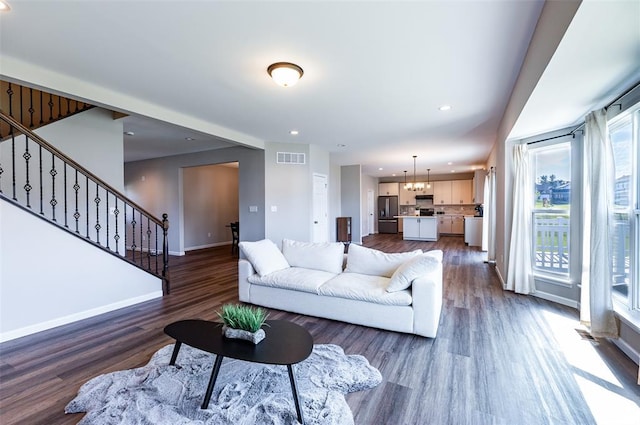 1051 Miremont Dr, Manchester, MO 63011 - living room with dark wood-type flooring, baseboards, stairway, and recessed lighting