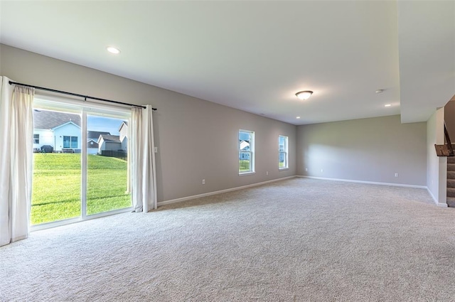 1051 Miremont Dr, Manchester, MO 63011 - unfurnished living room featuring light carpet, baseboards, and recessed lighting
