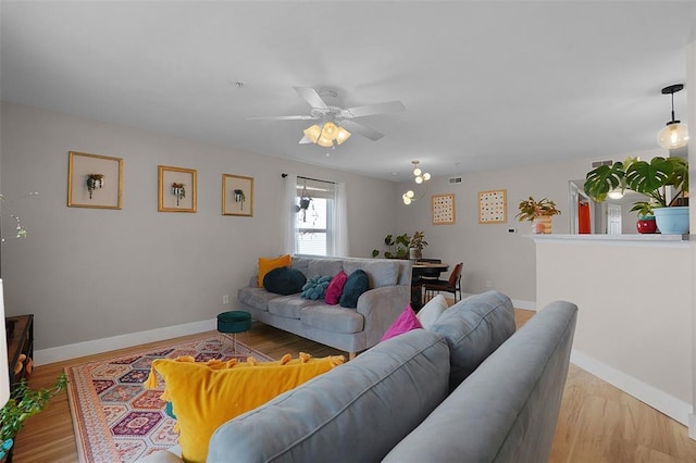 644 Homerun Dr Unit 39N, Ofallon, MO 63366 - living area with a ceiling fan, baseboards, and wood finished floors