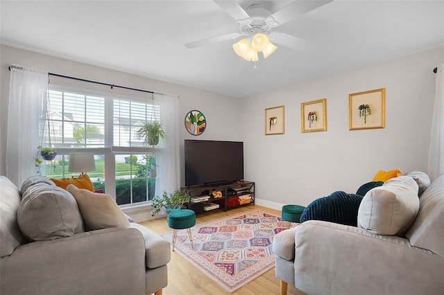 644 Homerun Dr Unit 39N, Ofallon, MO 63366 - living area featuring wood finished floors, baseboards, and ceiling fan