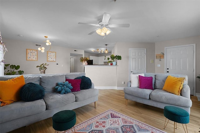 644 Homerun Dr Unit 39N, Ofallon, MO 63366 - living area featuring light wood-style floors, ceiling fan, and baseboards