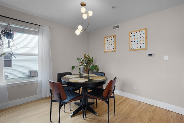644 Homerun Dr Unit 39N, Ofallon, MO 63366 - dining room featuring baseboards and light wood-style floors