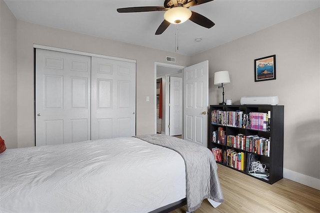 644 Homerun Dr Unit 39N, Ofallon, MO 63366 - bedroom featuring wood finished floors, baseboards, a closet, and ceiling fan