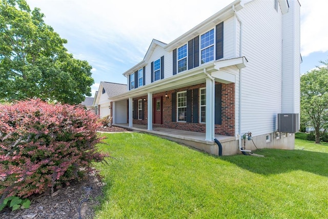326 Merrimac Downs, Saint Peters, MO 63376 - view of front of property with covered porch, central AC unit, a front lawn, and brick siding