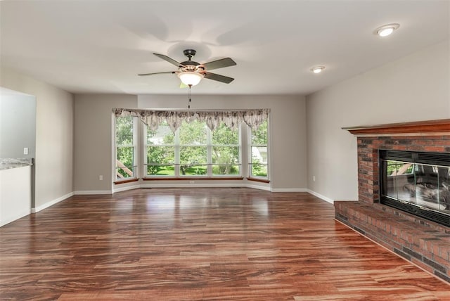 326 Merrimac Downs, Saint Peters, MO 63376 - unfurnished living room with baseboards, wood finished floors, ceiling fan, and a fireplace