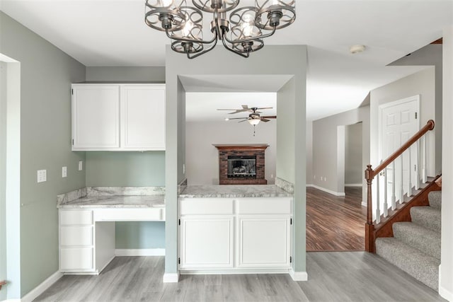 326 Merrimac Downs, Saint Peters, MO 63376 - kitchen with light wood-style floors, ceiling fan, white cabinets, and baseboards