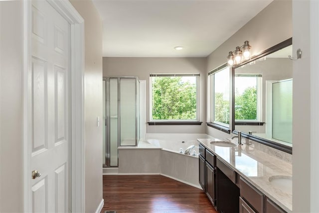 326 Merrimac Downs, Saint Peters, MO 63376 - full bathroom featuring a garden tub, double vanity, wood finished floors, and a stall shower