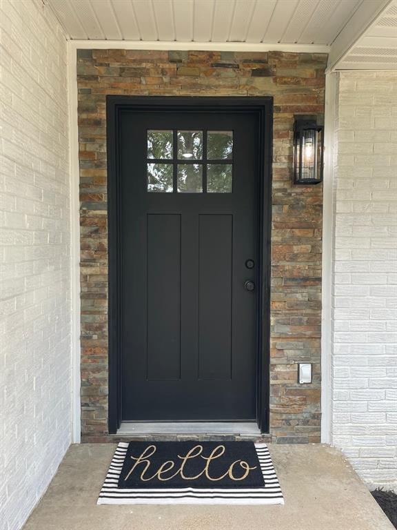 633 E Eldon St, St James, MO 65559 - property entrance featuring brick siding