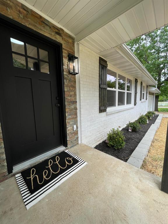 633 E Eldon St, St James, MO 65559 - property entrance featuring brick siding