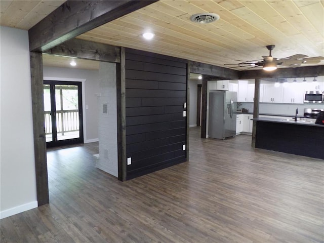 633 E Eldon St, St James, MO 65559 - unfurnished living room featuring wooden ceiling, ceiling fan, dark wood-style floors, and baseboards