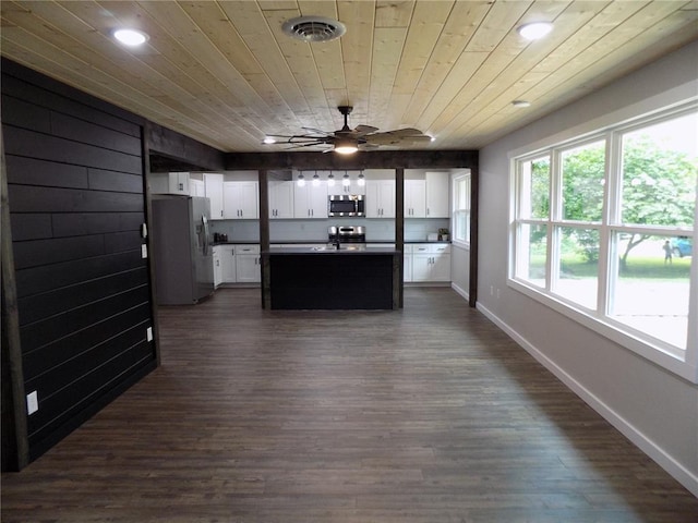 633 E Eldon St, St James, MO 65559 - kitchen with appliances with stainless steel finishes, dark countertops, white cabinets, baseboards, and recessed lighting
