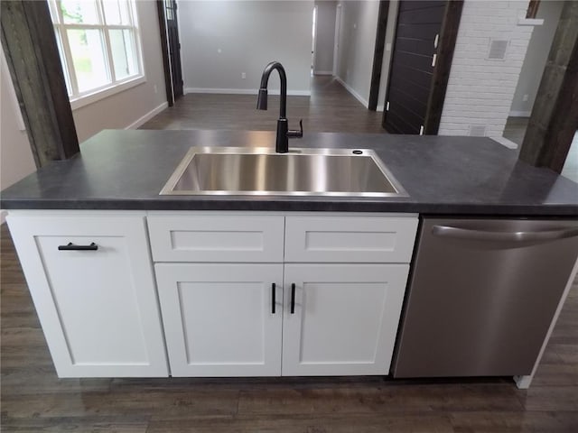 633 E Eldon St, St James, MO 65559 - kitchen featuring dishwasher, a sink, dark wood-style floors, and white cabinetry