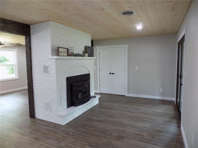 633 E Eldon St, St James, MO 65559 - unfurnished living room with wood ceiling, dark wood-type flooring, and baseboards