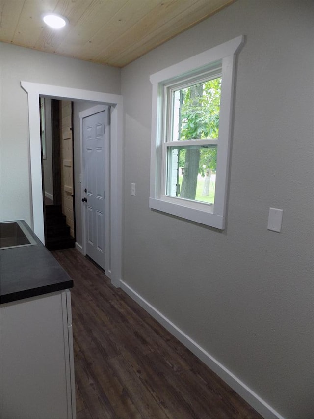 633 E Eldon St, St James, MO 65559 - hallway with dark wood-style floors and baseboards