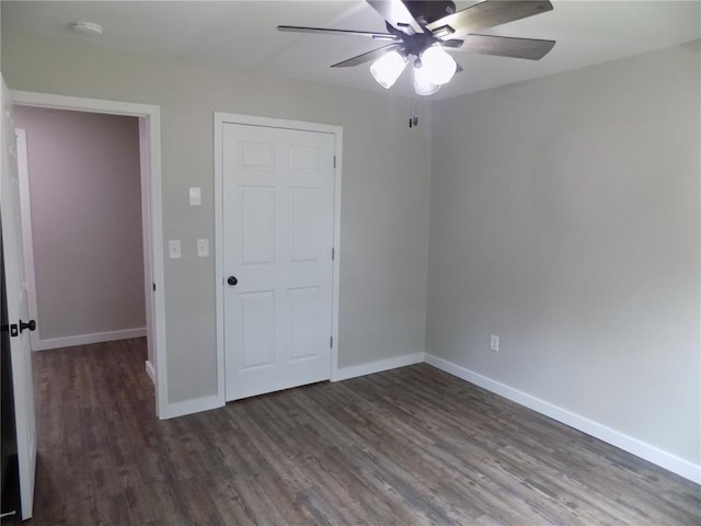 633 E Eldon St, St James, MO 65559 - unfurnished room featuring ceiling fan, dark wood-type flooring, baseboards, and a smoke detector