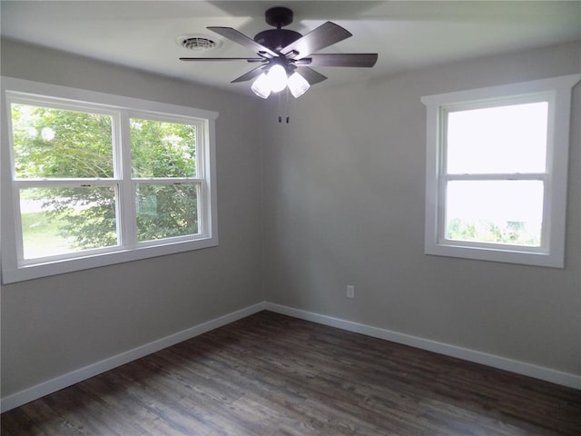 633 E Eldon St, St James, MO 65559 - spare room featuring ceiling fan, baseboards, and dark wood-style floors
