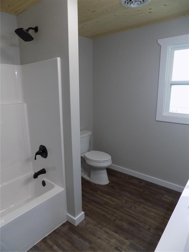 633 E Eldon St, St James, MO 65559 - full bath with toilet, shower / bath combination, wood finished floors, and baseboards