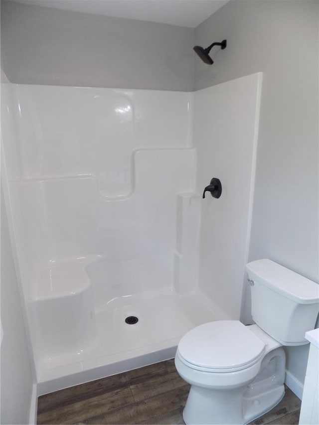 633 E Eldon St, St James, MO 65559 - bathroom with toilet, wood finished floors, a shower, and vanity