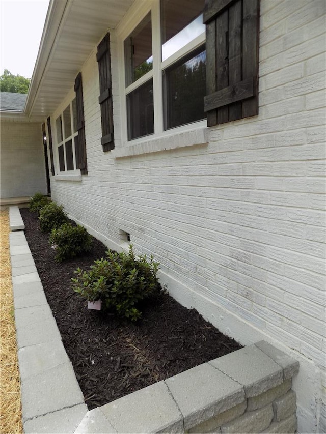 633 E Eldon St, St James, MO 65559 - view of property exterior featuring brick siding and crawl space