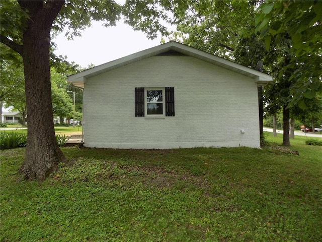 633 E Eldon St, St James, MO 65559 - view of side of home featuring brick siding and a lawn