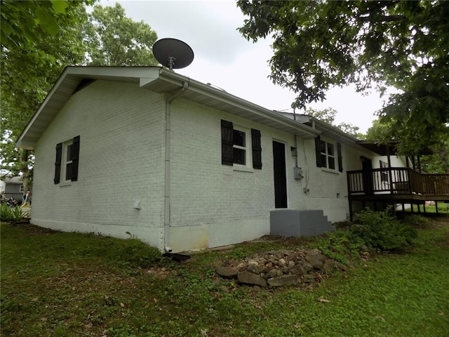633 E Eldon St, St James, MO 65559 - back of house with brick siding, a wooden deck, and cooling unit