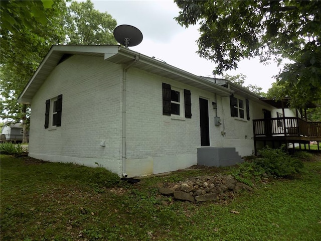 633 E Eldon St, St James, MO 65559 - view of side of property featuring brick siding and a deck