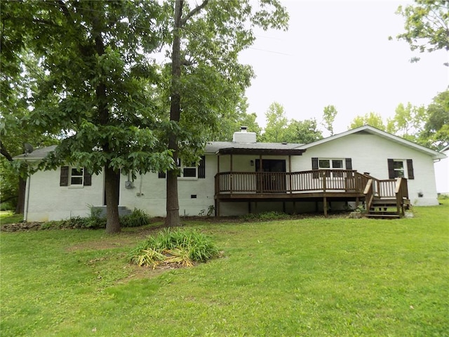 633 E Eldon St, St James, MO 65559 - back of house featuring a deck, a lawn, and a chimney