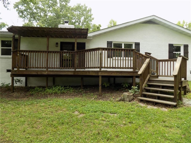 633 E Eldon St, St James, MO 65559 - rear view of house featuring a deck, a chimney, and a lawn