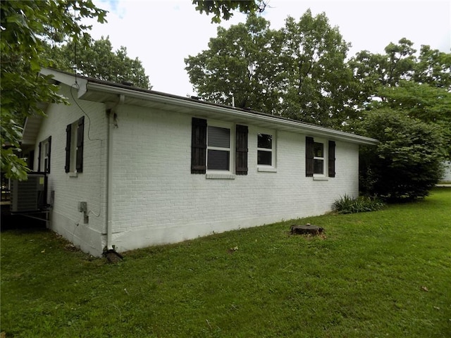 633 E Eldon St, St James, MO 65559 - view of home's exterior with brick siding, a yard, and central air condition unit