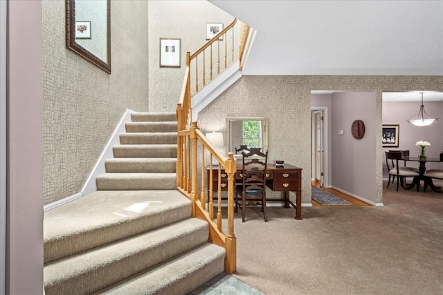537 Colebrook Dr Unit C, Webster Groves, MO 63119 - stairs with carpet flooring, a towering ceiling, and baseboards