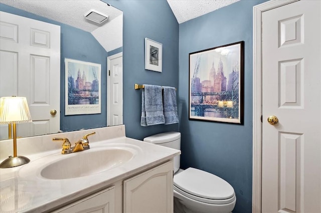 537 Colebrook Dr Unit C, Webster Groves, MO 63119 - bathroom featuring a textured ceiling, toilet, and vanity