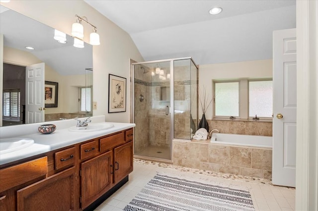 537 Colebrook Dr Unit C, Webster Groves, MO 63119 - full bathroom with vaulted ceiling, double vanity, a stall shower, tile patterned floors, and a garden tub