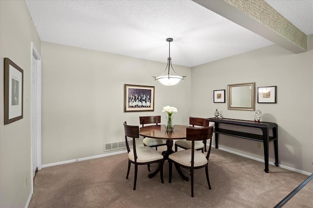 537 Colebrook Dr Unit C, Webster Groves, MO 63119 - dining space with carpet floors, a textured ceiling, and baseboards
