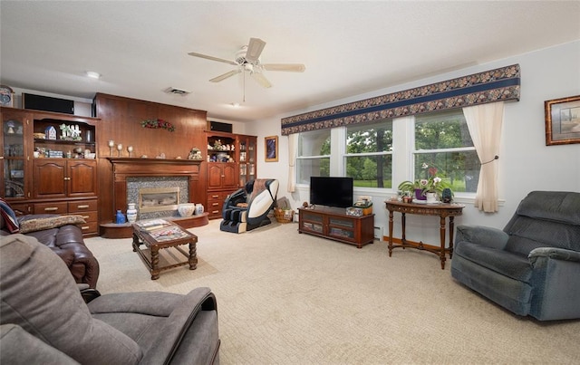 17130 State Route F, St James, MO 65559 - living area featuring a ceiling fan, light carpet, and a glass covered fireplace