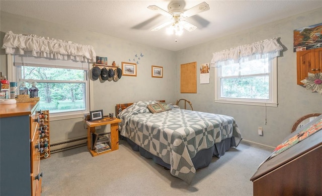 17130 State Route F, St James, MO 65559 - bedroom with light colored carpet, multiple windows, baseboard heating, and ceiling fan