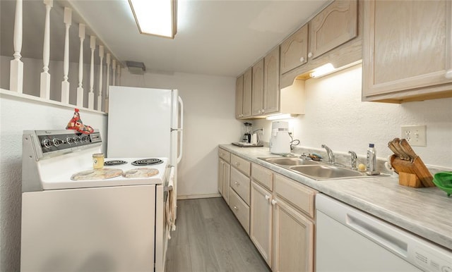 17130 State Route F, St James, MO 65559 - kitchen with white appliances, a sink, light wood-style floors, light countertops, and light brown cabinets