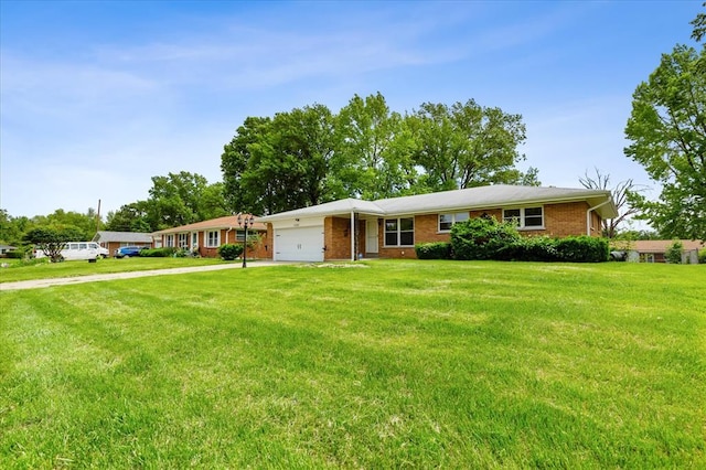 11550 Rock Hampton Dr, Hazelwood, MO 63138 - ranch-style home featuring driveway, an attached garage, a front yard, and brick siding