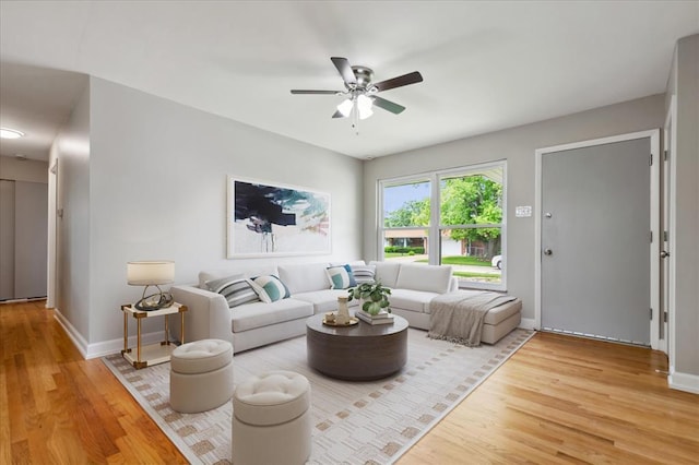 11550 Rock Hampton Dr, Hazelwood, MO 63138 - living area featuring wood finished floors, ceiling fan, and baseboards