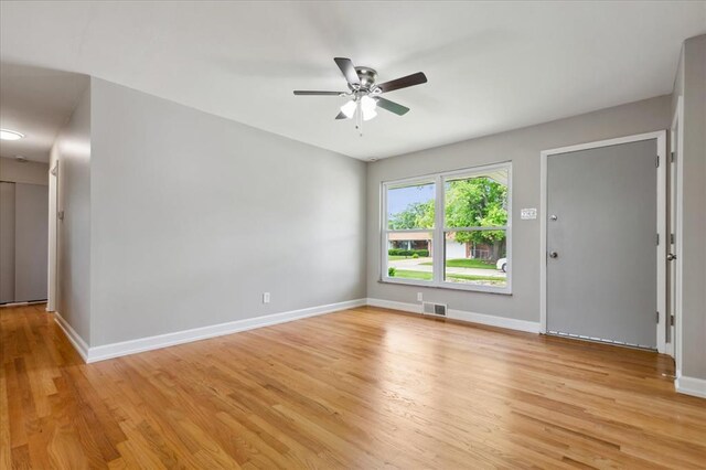 11550 Rock Hampton Dr, Hazelwood, MO 63138 - spare room featuring light wood-style flooring, ceiling fan, and baseboards