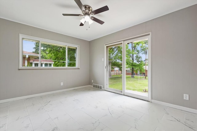 11550 Rock Hampton Dr, Hazelwood, MO 63138 - spare room with marble finish flooring, baseboards, and a ceiling fan