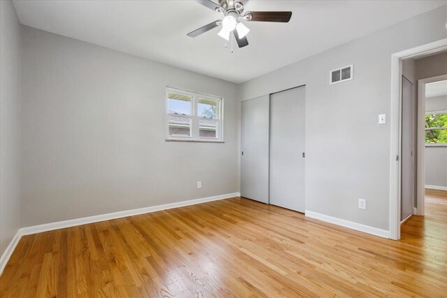 11550 Rock Hampton Dr, Hazelwood, MO 63138 - unfurnished bedroom with light wood finished floors, a closet, baseboards, and a ceiling fan