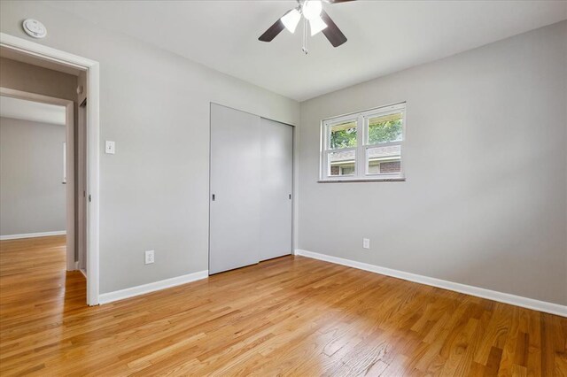 11550 Rock Hampton Dr, Hazelwood, MO 63138 - unfurnished bedroom featuring light wood-style flooring, a closet, and baseboards
