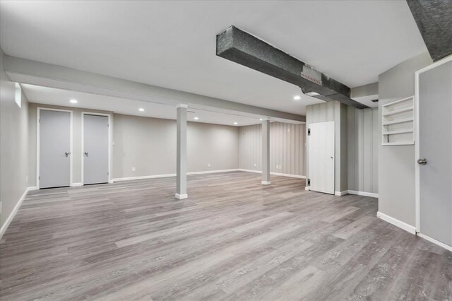 11550 Rock Hampton Dr, Hazelwood, MO 63138 - finished below grade area with wood finished floors, baseboards, and recessed lighting