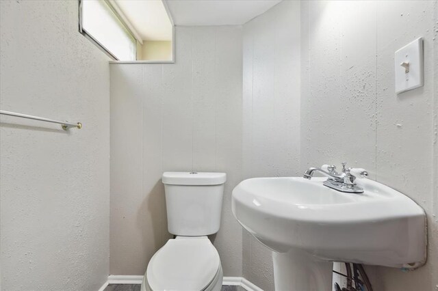 11550 Rock Hampton Dr, Hazelwood, MO 63138 - half bathroom featuring toilet and a sink