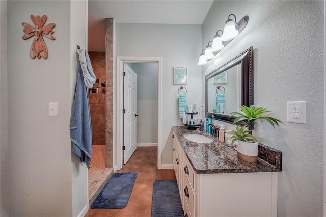 14901 State Route Ff, Edgar Springs, MO 65462 - bathroom with vanity, a tile shower, and baseboards