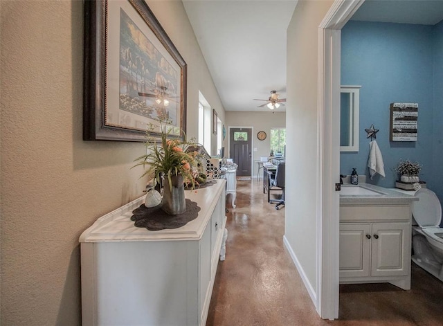 14901 State Route Ff, Edgar Springs, MO 65462 - hallway with concrete flooring, a sink, and baseboards
