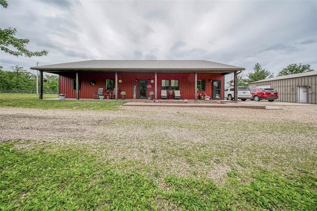 14901 State Route Ff, Edgar Springs, MO 65462 - back of house with a yard, a porch, and metal roof