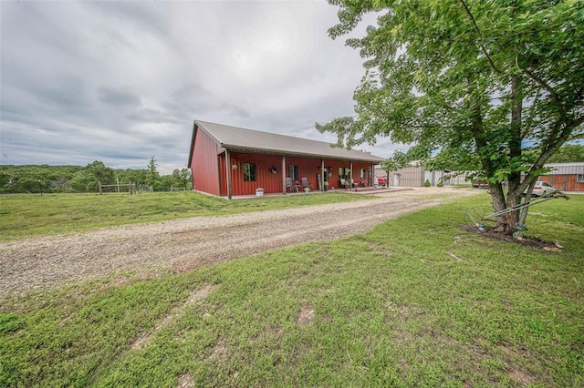 14901 State Route Ff, Edgar Springs, MO 65462 - ranch-style home with dirt driveway, a front yard, an outdoor structure, metal roof, and a pole building
