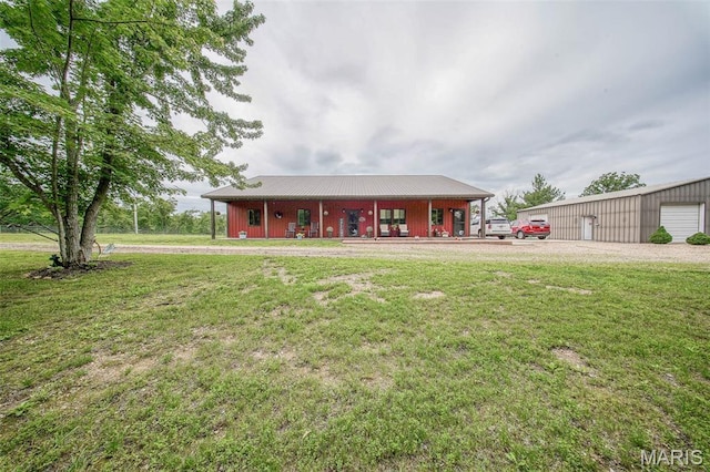 14901 State Route Ff, Edgar Springs, MO 65462 - ranch-style house featuring a front lawn, a porch, and an outbuilding