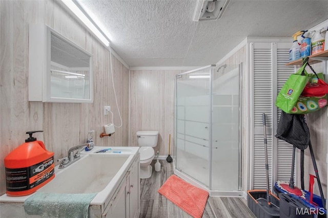 14901 State Route Ff, Edgar Springs, MO 65462 - full bath with wood finished floors, vanity, a textured ceiling, a shower stall, and wooden walls